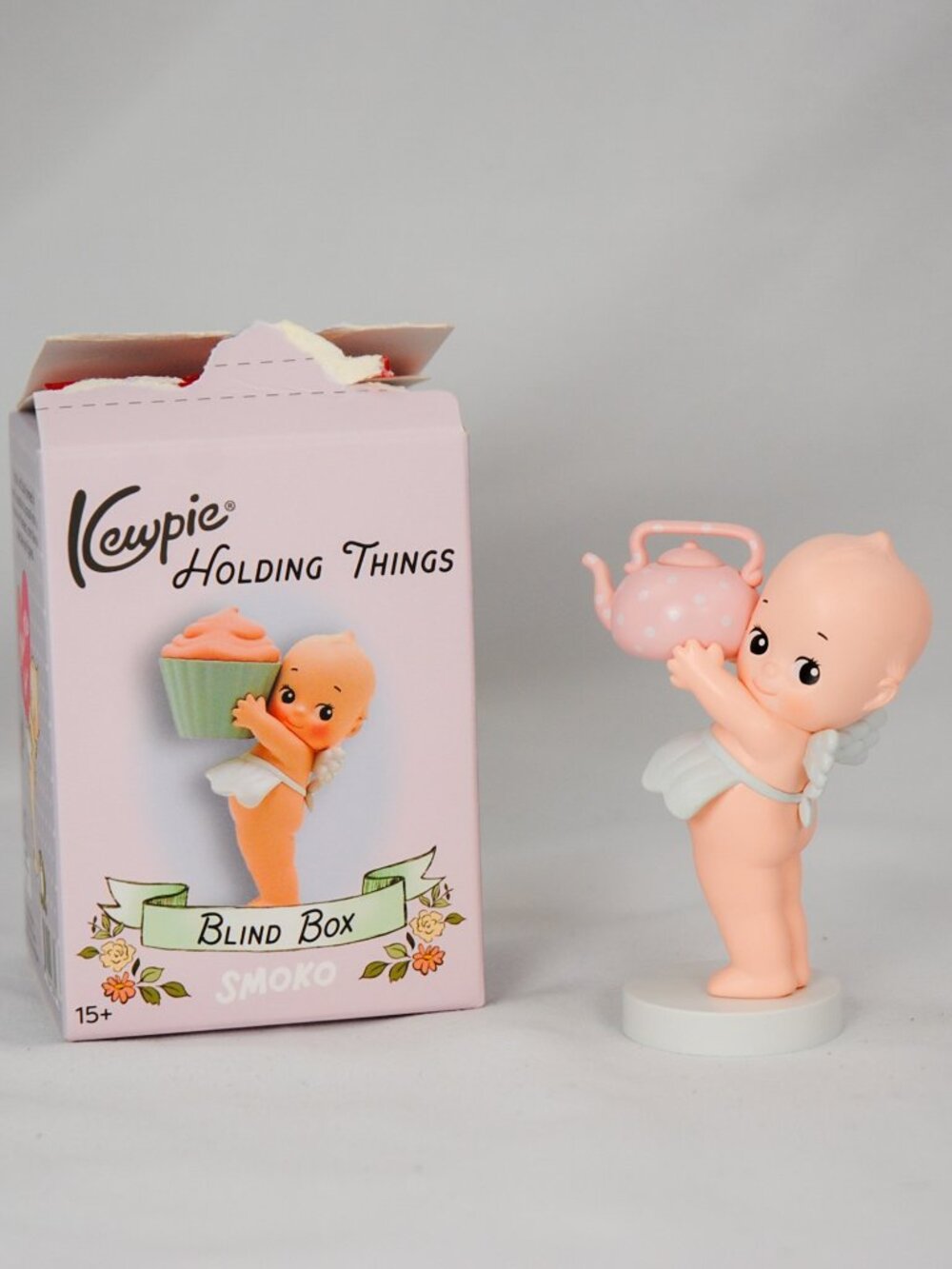 Kewpie Holding Things